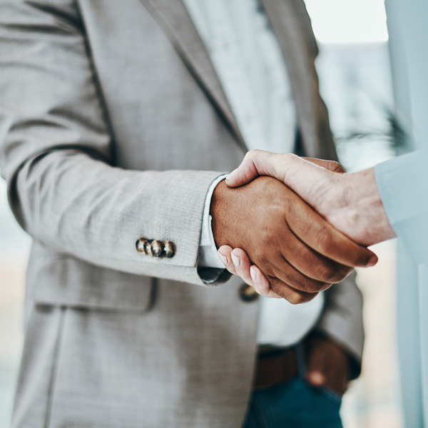 Two people are hand shaking